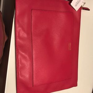 A Pink coach clutch or iPad holder